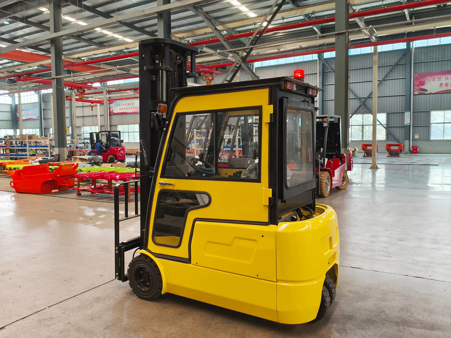 Rear-side angle of yellow forklift parked in factory