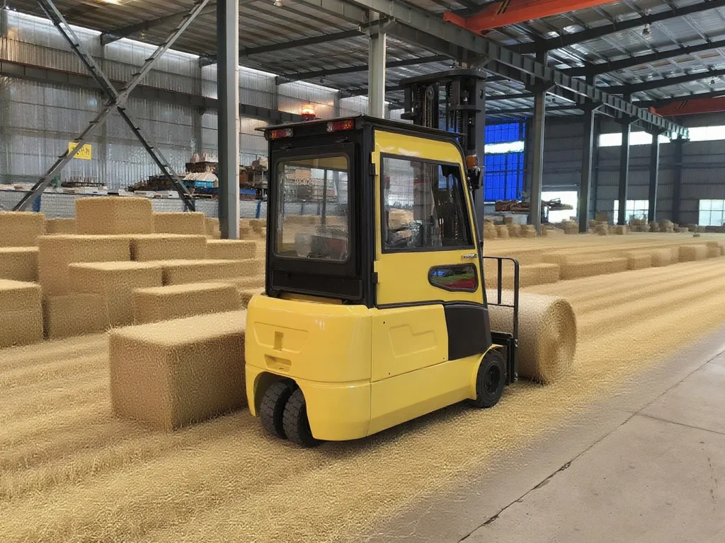 Yellow electric forklift driving through racking aisle