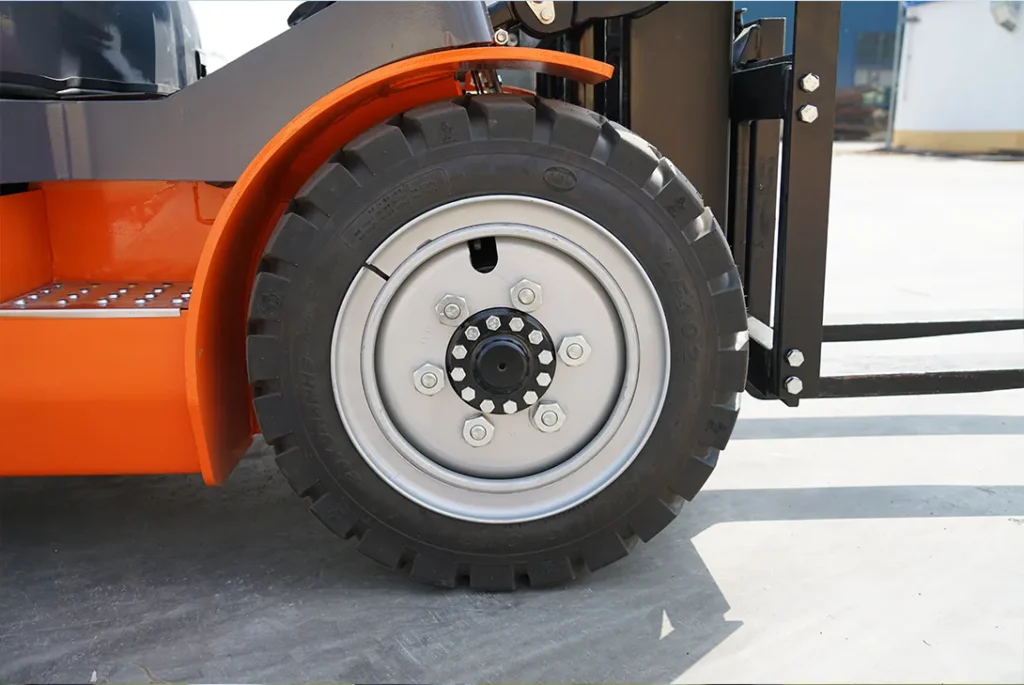 Close-up of rear tire and wheel hub on electric forklift