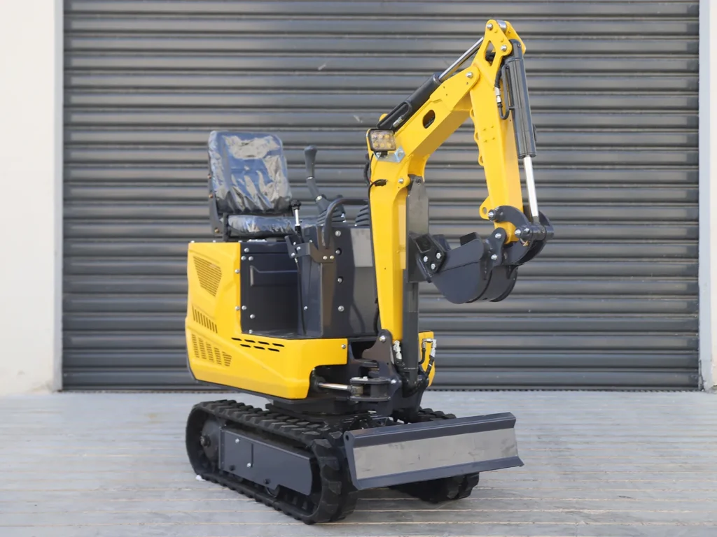 06 mini excavator parked outdoors near shutter door