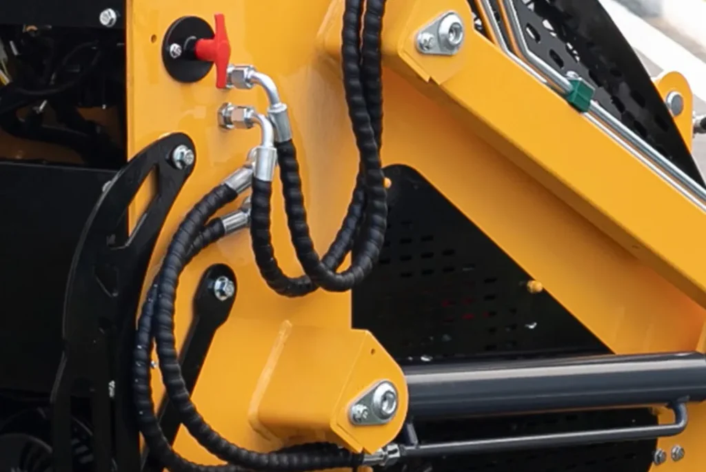 T360 skid steer loader hydraulic pipeline and connector close-up