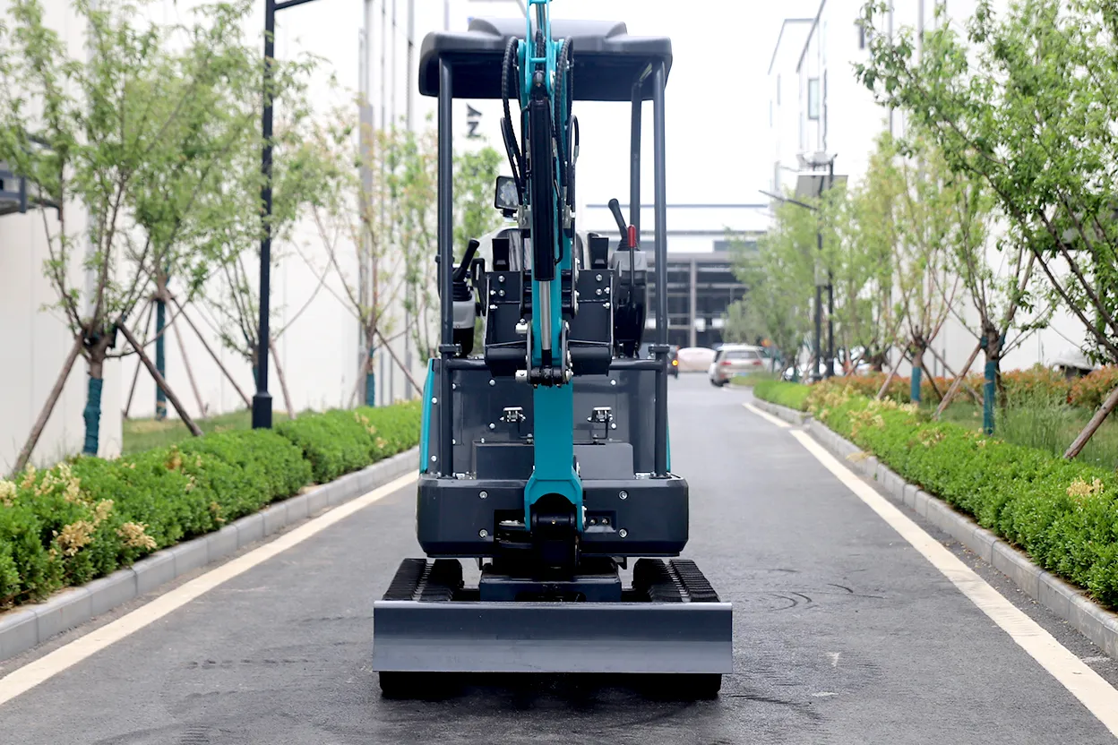 18Q mini excavator front view on roadway with boom centered