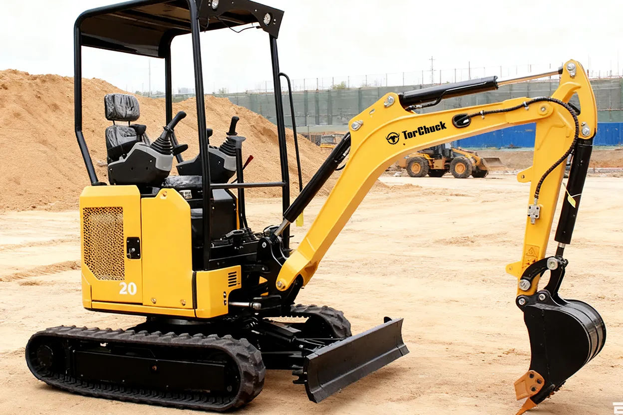 20C mini excavator on job site, boom lowered and bucket resting on ground