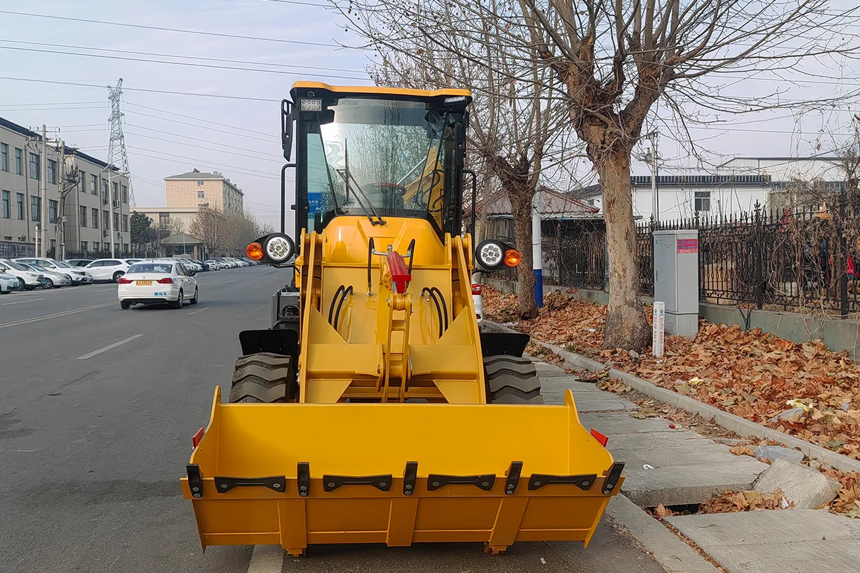 Front view of TCB 10-20 backhoe loader parked on roadside