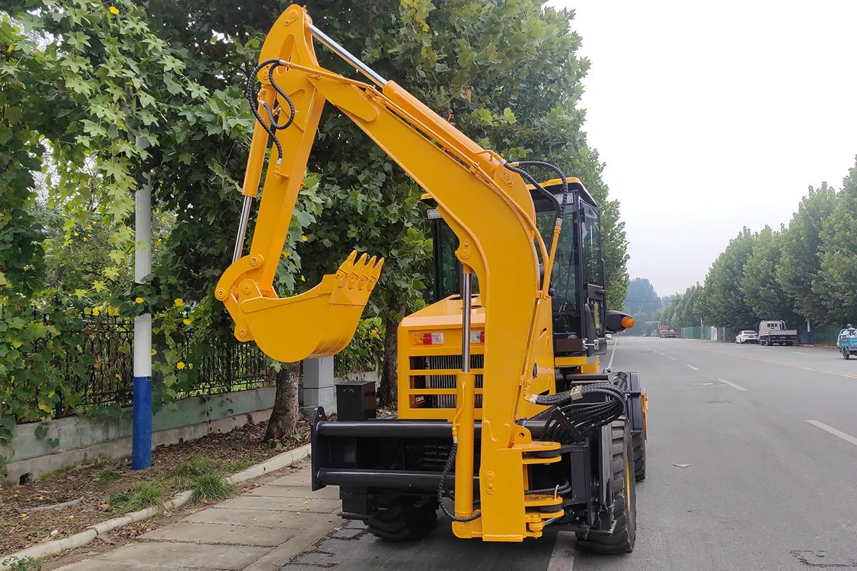 Side view of TCB 15-26 backhoe loader with rear boom extended on city street