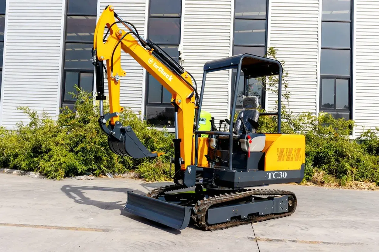 TC30 excavator left-side view with digging bucket lifted